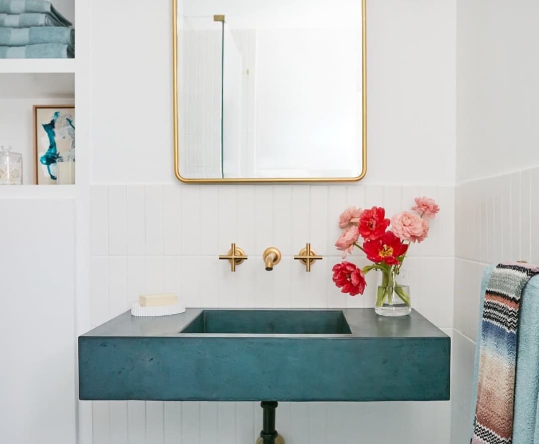 beautiful concrete sink with red flowers